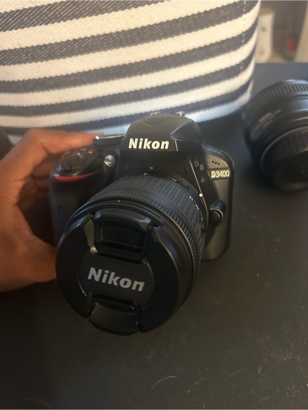Nikon D3400 Black DSLR with Attached Nikon Lens